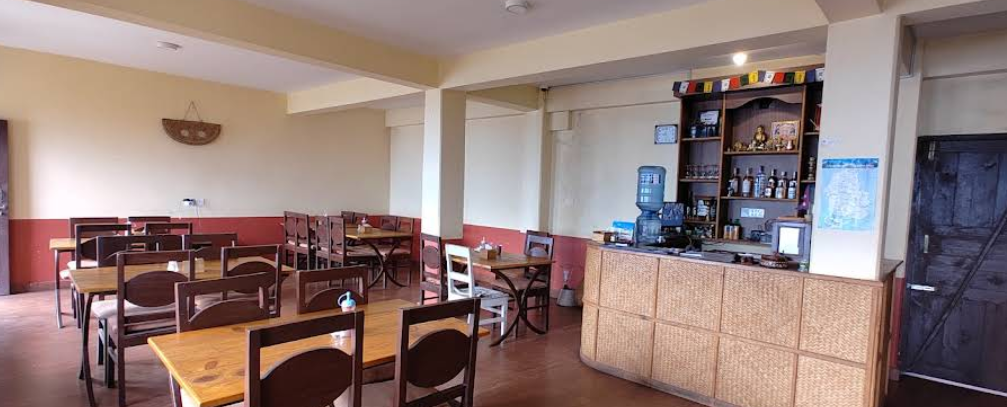 The warm red and cream dining hall of the eco lodge